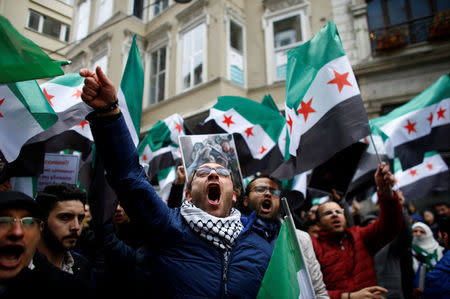 Syrians living in Istanbul gather in front of the Russian Consulate during a protest in Istanbul, Turkey February 22, 2018. REUTERS/Osman Orsal