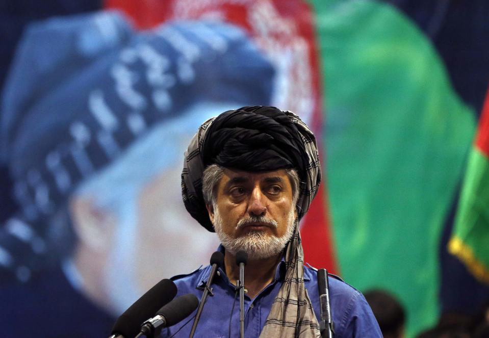 Afghan presidential candidate Abdullah Abdullah speaks during a gathering with his supporters in Kabul, July 8, 2014. Abdullah told thousands of supporters on Tuesday he was the winner of last month's run-off election, putting himself on a collision course with his arch-rival, Ashraf Ghani. (REUTERS/Omar Sobhani)