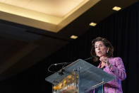 In this Tuesday, Sept. 28, 2021, photo Commerce Secretary Gina Raimondo speaks at The Economic Club of Washington. As President Joe Biden's de facto tech minister, Raimondo is tasked with ensuring the United States will be the world leader in computer chips. There is a global shortage, creating a drag on growth and fueling inflation on the cusp of the 2022 elections. Raimondo is working to increase production of chips as well as solar panels and batteries to help the United States thrive. (AP Photo/Alex Brandon)