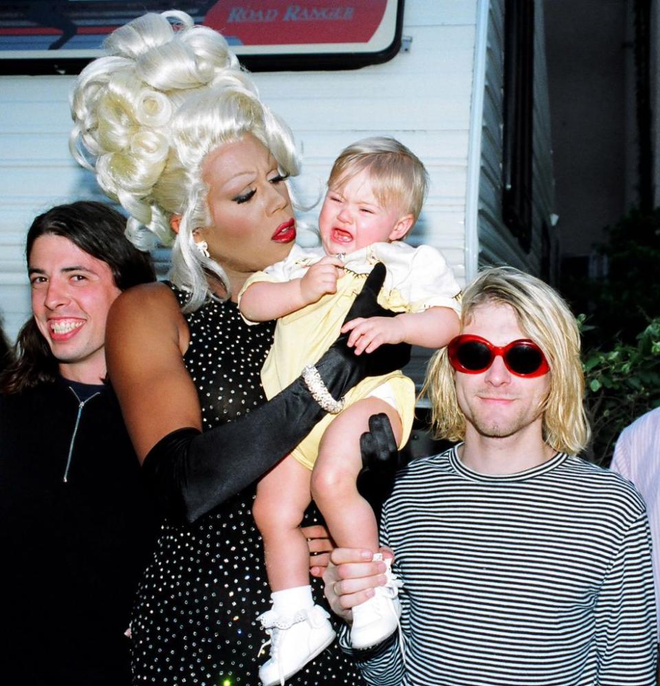 <p>Drag superstar Ru Paul holding Kurt Cobain's baby Frances Bean Cobain. Cobain was an outspoken and prominent supporter of LGBTQ rights and acceptance.</p>