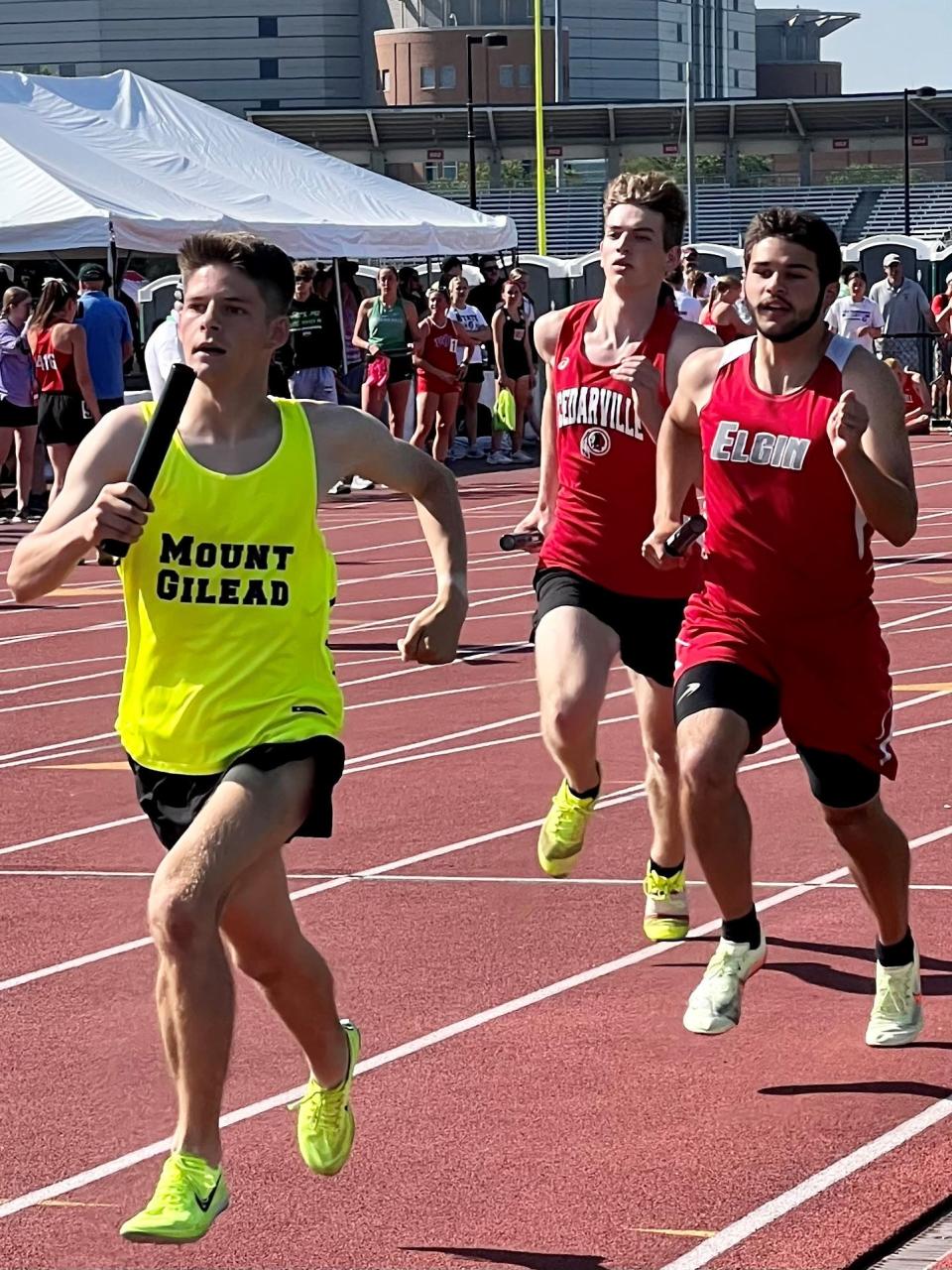 Mount Gilead's Parker Bartlett leads Elgin's Sage Brewer during a leg of the 4x800-meter relay during the Division III boys state track championships at Ohio State's Jesse Owens Memorial Stadium.