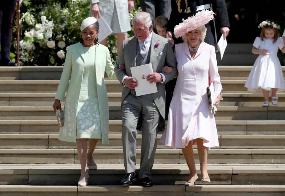 Prince Charles held Doria Ragland’s arm as they exited the chapel after the royal wedding [Photo: Getty]