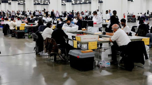 PHOTO: In this Nov. 4, 2020, file photo, election workers work on counting absentee ballots for the 2020 general election at TCF Center, on Nov. 4, 2020, in Detroit. (Jeff Kowalsky/AFP via Getty Images, FILE)