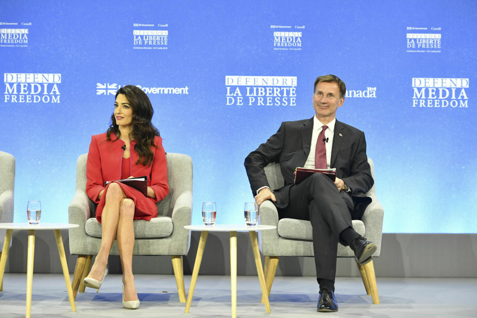 Amal Clooney and Britain's Foreign Secretary Jeremy Hunt during the Global Conference for Media Freedom at The Printworks in London, Wednesday, July 10, 2019. (Dominic Lipinski/PA via AP)