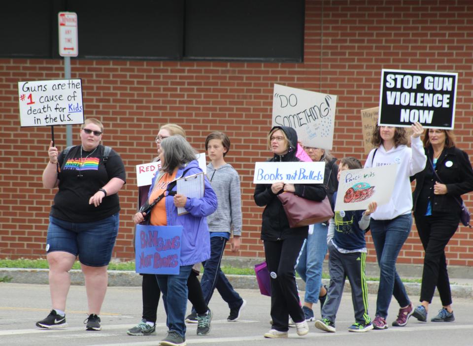 Participants in the March for Our Lives Walk and Rally travel Main Street in the Village of Wellsville Saturday. Similar events were held across the country to push for gun control legislation in the wake of a mass shooting in Uvalde, Texas that killed 21 people, including 19 children.