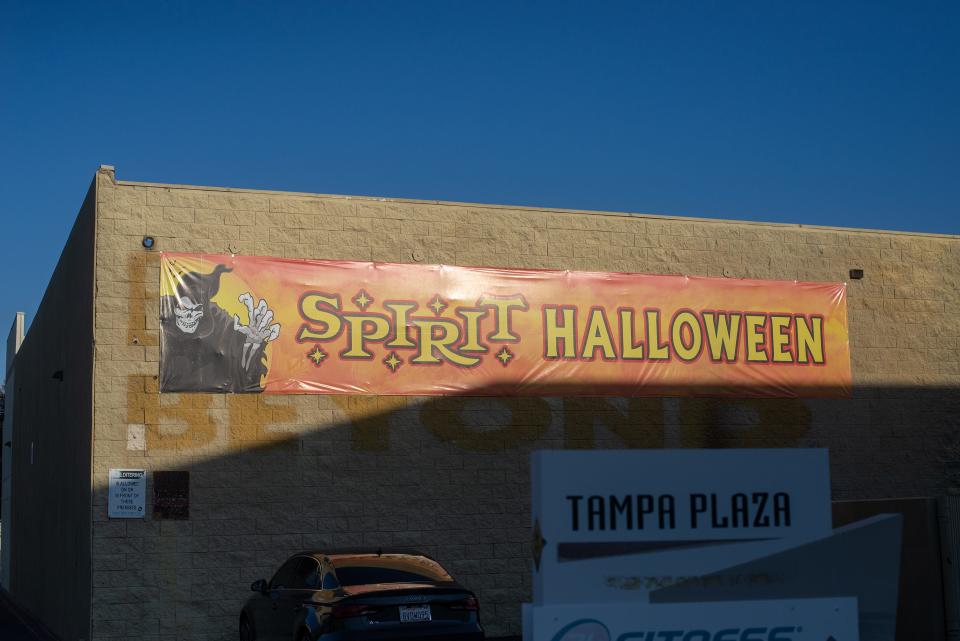 A Spirit Halloween sign hangs on the backside of a Spirit Halloween store at Tampa Plaza in Northridge, Calif. The space the store occupies was formerly a Bed Bath and Beyond.