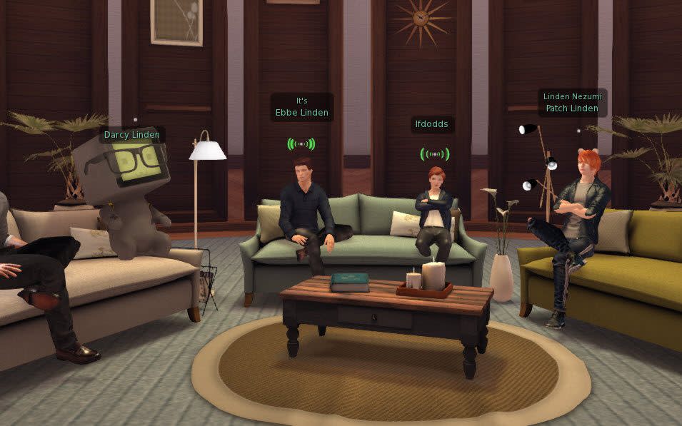 A selection of avatars, with varying degrees of normality, sitting on couches - Linden Lab