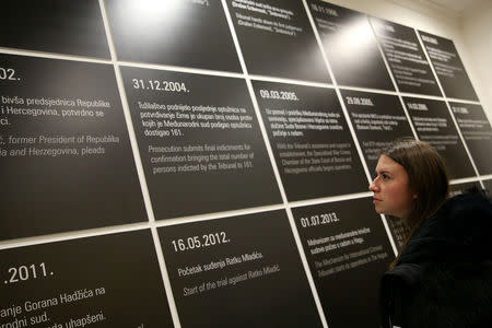 A student reads a panel with meaningful dates of trial, at the original courtroom of the United Nations International Criminal Tribunal for the former Yugoslavia (ICTY), as a part of their education, in Sarajevo City Hall, Bosnia and Herzegovina December 7, 2018. Picture taken December 7, 2018. REUTERS/Dado Ruvic