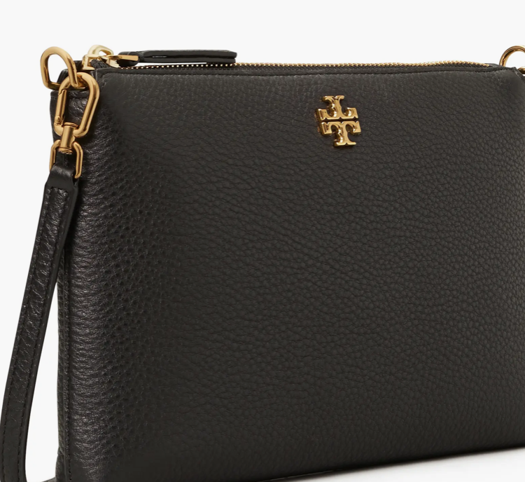 A close-up of the pebbled leather and gold hardware on the Tory Burch Mercer Bag.