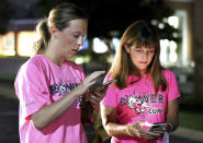 From left, event organizer Jenny Fogo and Wendy Ransom confer on the routeat Girls Preparatory School, for "Finish Eliza's Run" on Friday, Sept. 9, 2022 in Chattanooga, Tenn. The approximately four mile run was to memorialize, Eliza Fletcher, the Memphis runner, and mother of two, who was murdered during her early morning run. (Robin Rudd /Chattanooga Times Free Press via AP)