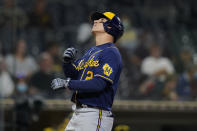 Milwaukee Brewers' Luis Urias looks skyward after hitting a home run during the third inning of a baseball game against the San Diego Padres, Monday, April 19, 2021, in San Diego. (AP Photo/Gregory Bull)