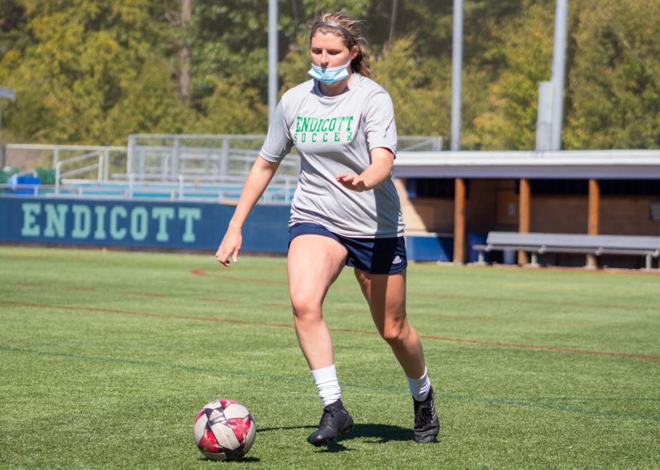 A masked of Jaymie Caponigro takes part in an Endicott College women's soccer practice during a season in which all intercollegiate games were canceled due to the coronavirus crisis.(Endicott College Sports Information)