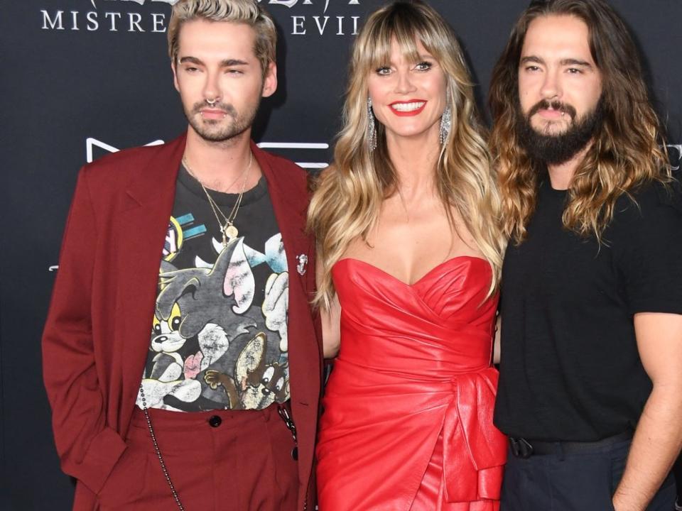 Die Brüder Bill (l.) und Tom Kaulitz mit Heidi Klum. (Bild: Birdie Thompson/AdMedia/ImageCollect)