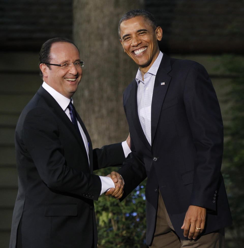 President Barack Obama shakes hands with French President Francois Hollande on arrival for the G8 Summit Friday, May 18, 2012 at Camp David, Maryland.