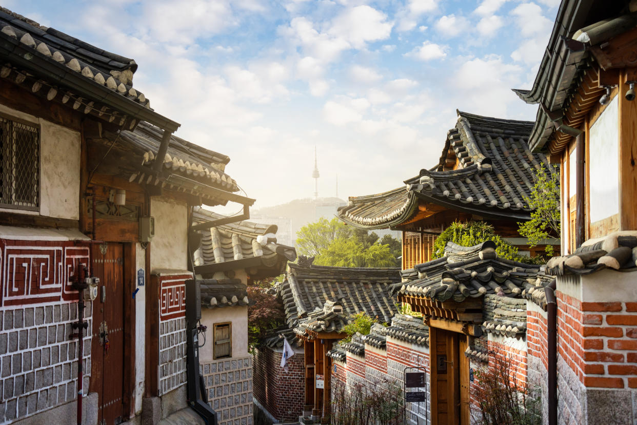 Street in Seoul City Among Old Town Buildings Against Sky at Sunrise