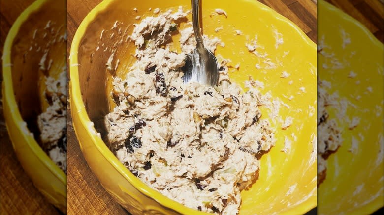 tuna salad in mixing bowl with spoon