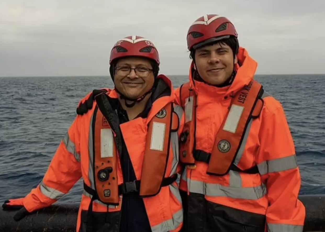 Shahzada and Suleman Dawood smile in the final photo taken before their doomed dive on board the Titan submersible (Sourced)