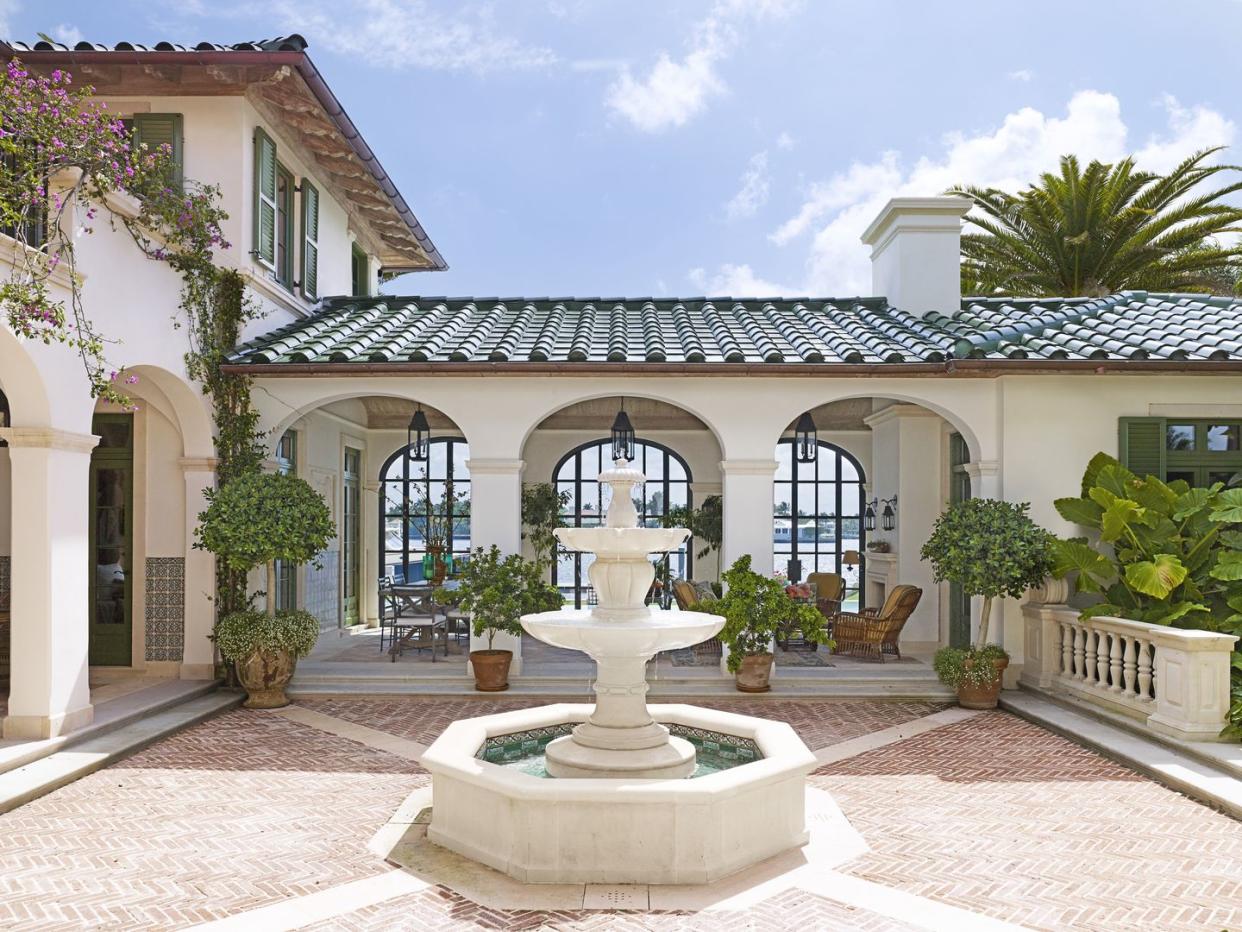 betsy shiverick palm beach fountain patio backyard veranda