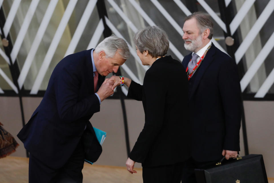 Michel Barnier kisses the hand of Theresa May as the EU summit in Brussels (Getty)