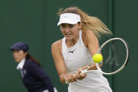 Belgium's Maryna Zanevska plays a return to Czech Republic's Barbora Strycova during the first round women's singles match on day one of the Wimbledon tennis championships in London, Monday, July 3, 2023. (AP Photo/Alastair Grant)