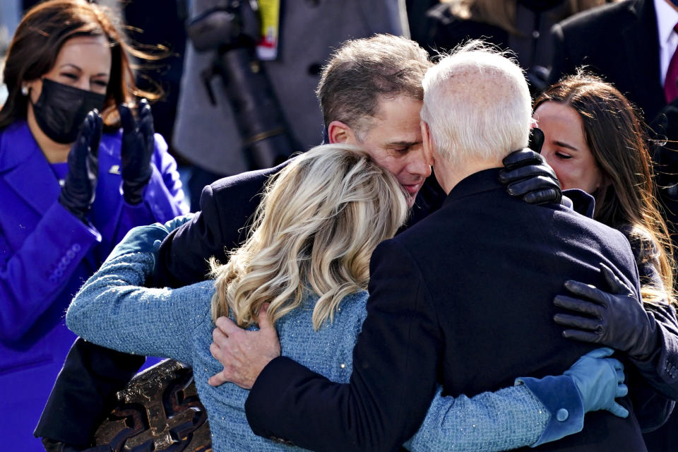 U.S. Vice President Kamala Harris applauds as President Joe Biden is embraced by his son Hunter, first lady Jill Biden and daughter Ashley, during the 59th presidential inauguration in Washington, Wednesday, Jan. 20, 2021. (Kevin Dietsch/Pool Photo via AP)