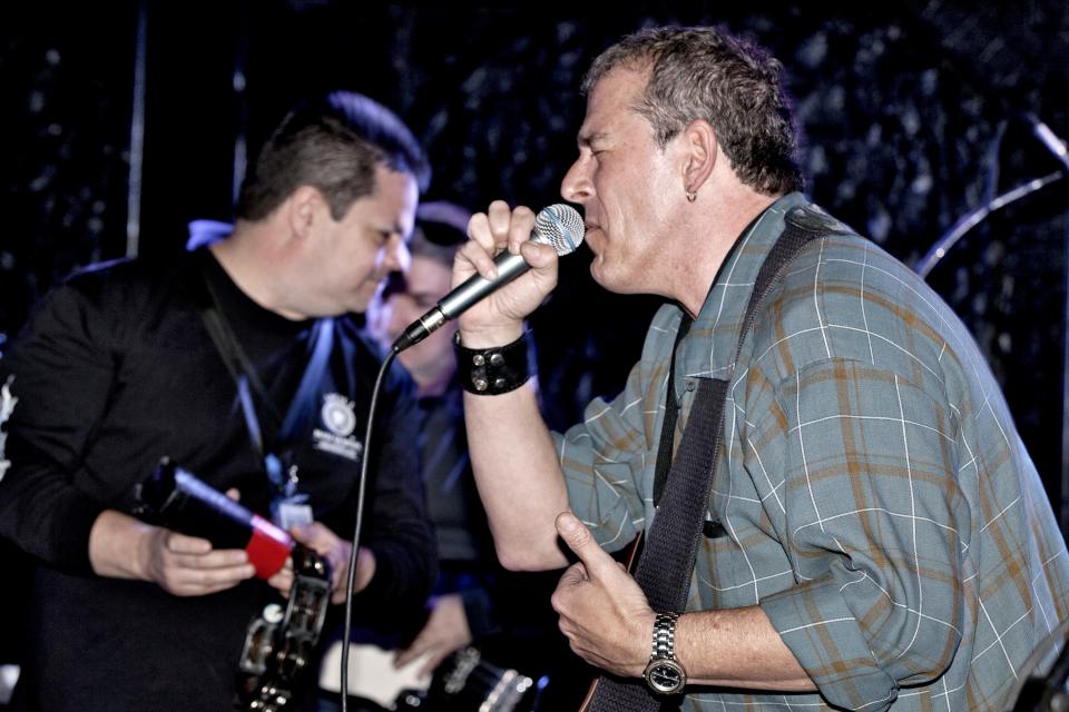 Glenn Stuart (right) performs with Springsteen tribute band The B Street Band during a 2012 benefit for the family of local musician and former Springsteen bandmate Vinnie Roslin at The Headliner in Neptune.