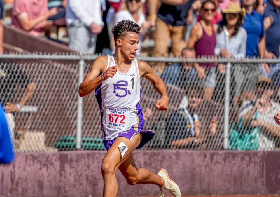 Devan Kipyego checks the field behind him as he nears the finish line of the 1,500 during the RIIL Track and Field Championships.