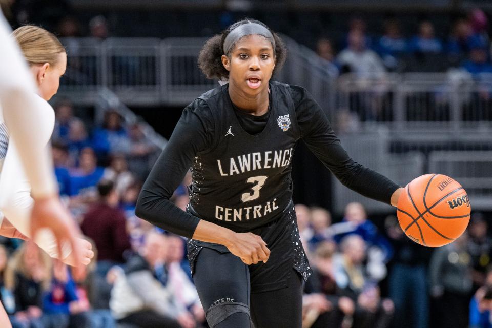 Lawrence Central High School sophomore Lola Lampley (3) drives toward the basket during the second half of an IHSAA class 4A girls’ basketball state finals game against Lake Central high School, Saturday, Feb. 24, 2024, at Gainbridge Fieldhouse, in Indianapolis. Lawrence Central won the school’s first state championship title in girl’s basketball.