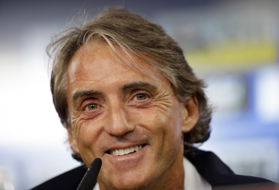 Italy coach Roberto Mancini smiles during a news conference at the Luz stadium in Lisbon, Sunday, Sept. 9, 2018. Italy will play Portugal Monday in a UEFA Nations League soccer match. (AP Photo/Armando Franca)