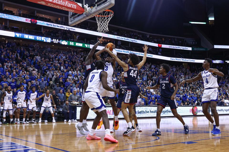 Seton Hall Pirates forward KC Ndefo (13) scores the game-winning basket after being fouled by Connecticut Huskies forward Adama Sanogo (21) during the second half in front of guard Kadary Richmond (0) and guard Andre Jackson Jr. (44) at Prudential Center.