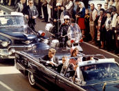 President and Mrs. John F. Kennedy, and Texas Governor John Connally ride through Dallas moments before Kennedy was assassinated, November 22, 1963. STR New / Reuters