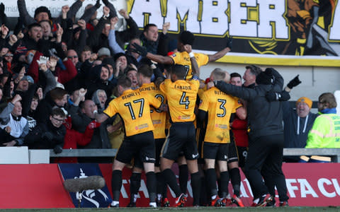 Newport County players celebrate - How Mike Flynn's band of misfits put Newport back on the right path as Welsh prepare for FA Cup visit of Spurs - Credit:  PA