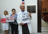 <p>Retired family physician Jay Brock of Fredericksburg, Va., joins other protesters against the Republican health care bill outside the office of Senate Majority Leader Mitch McConnell of Ky., Monday, July 17, 2017, on Capitol Hill in Washington. (Photo: Manuel Balce Ceneta/AP) </p>