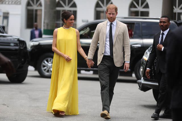 <p>KOLA SULAIMON/AFP via Getty</p> Meghan Markle and Prince Harry at the State Governor House in Lagos, Nigeria on May 12, 2024.