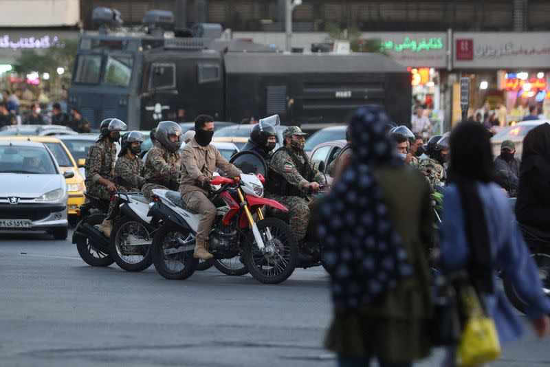 FILE PHOTO: Riot police officers ride motorcycles in a street in Tehran, Iran