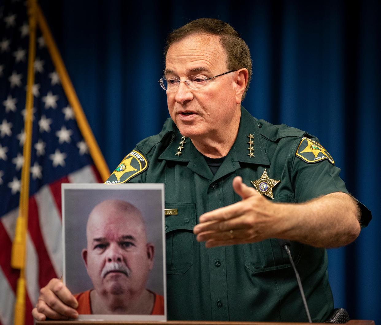 Polk Sheriff Grady Judd points to a photo of Polk Detention Deputy Robert Collins, who was arrested and charged with unlawful solicitation of a female inmate, during a press conference at the Sheriff’s Operation Center in Winter Haven.