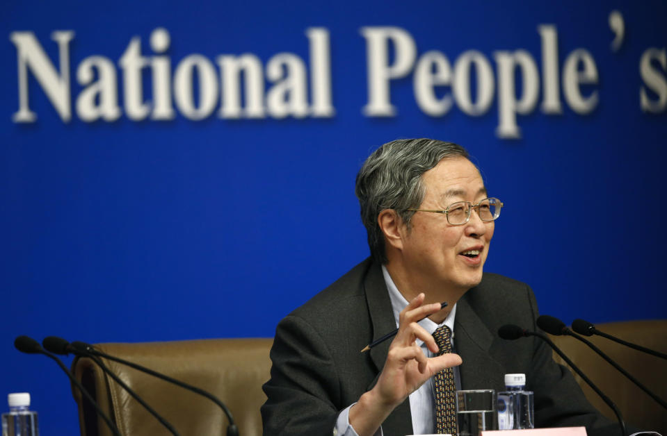 People's Bank of China governor Zhou Xiaochuan speaks at a press conference during the National People's Congress at the media center in Beijing, China, Tuesday, March 11, 2014. Zhou said Beijing might finish the process of easing controls on interest rates within two years and market forces will set the pace for allowing use of its tightly controlled currency abroad. (AP Photo/Vincent Thian)