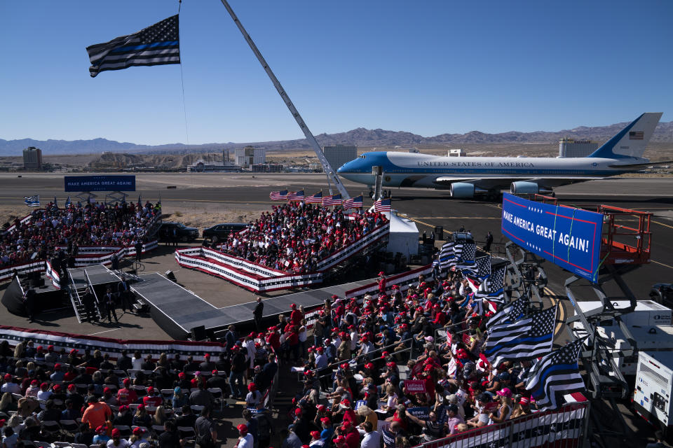 FILE - President Donald Trump speaks during a campaign rally at Laughlin/Bullhead International Airport, Oct. 28, 2020, in Bullhead City, Ariz. Trump adhered to rules on reimbursements for campaign travel during his failed bid for a second term. However, he drew scrutiny for blurring the lines in other ways. For example, he used Air Force One and Marine One as backdrops for political events, and he would direct the plane to be flown over his rallies to energize supporters. (AP Photo/Evan Vucci, File)