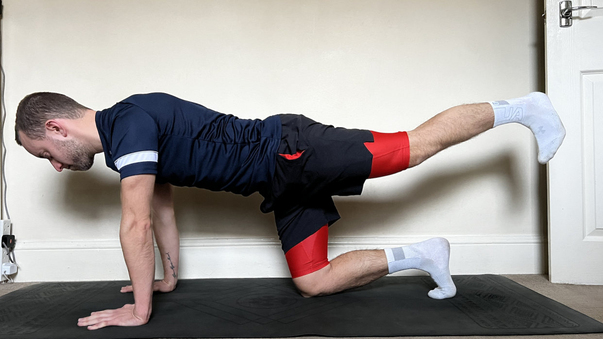  James Frew performing a Pilates workout. 