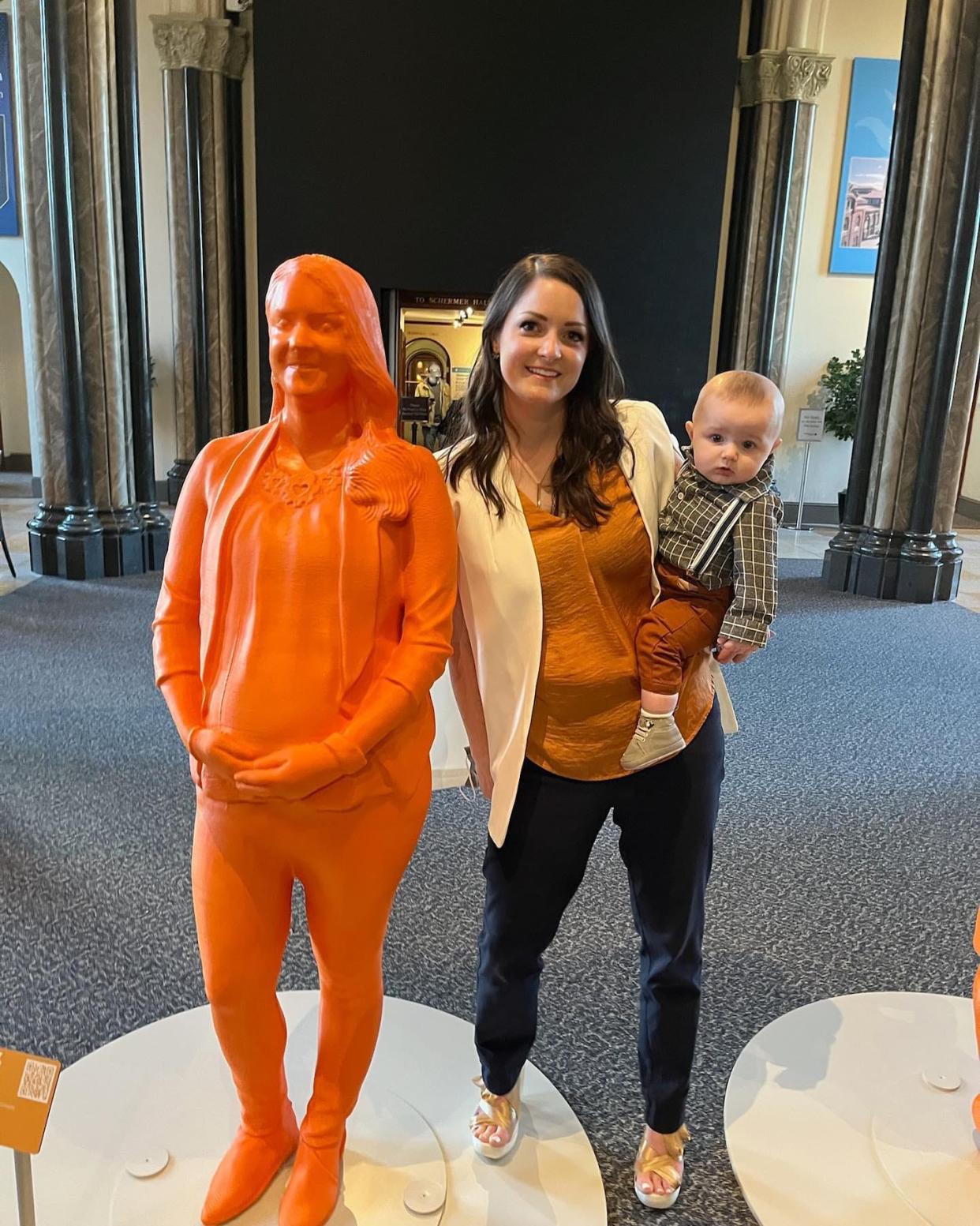Oak Ridge National Laboratory manufacturing scientist Amy Elliott, with son John Luke, is among the women in STEM featured with a life-size statue in a new exhibit, IfThenSheCan, at the Smithsonian to commemorate Women in History month.