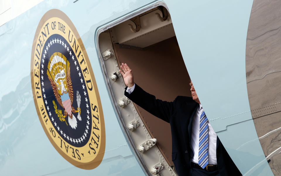 President Trump waves as he boards Air Force One at Andrews Air Force Base, Md., to travel to West Palm Beach, Fla., on March 23, 2018. (Photo: Carolyn Kaster/AP)