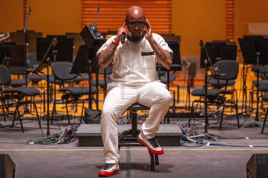 “If you are a deep Tech N9ne fan, you know orchestral sounds and elements have been in my music since the beginning,” says Rapper Tech N9ne, seen checking his in-ear monitor before rehearsing with the Kansas City Symphony. Emily Curiel/ecuriel@kcstar.com