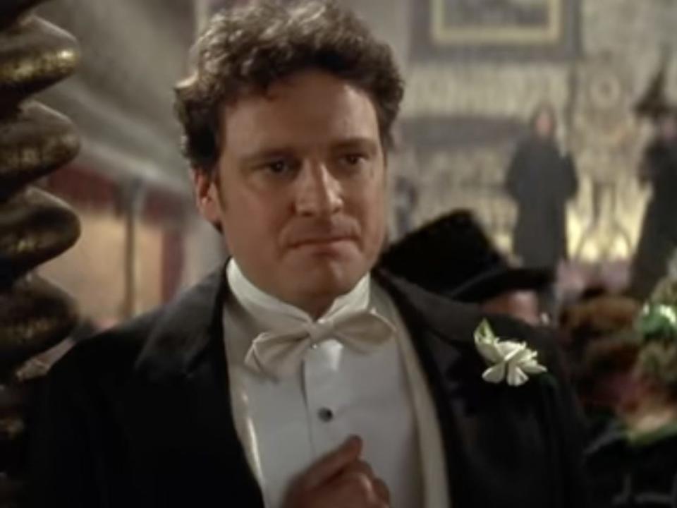 Colin Firth dressed in a suit for a social event in "The Importance of Being Earnest."