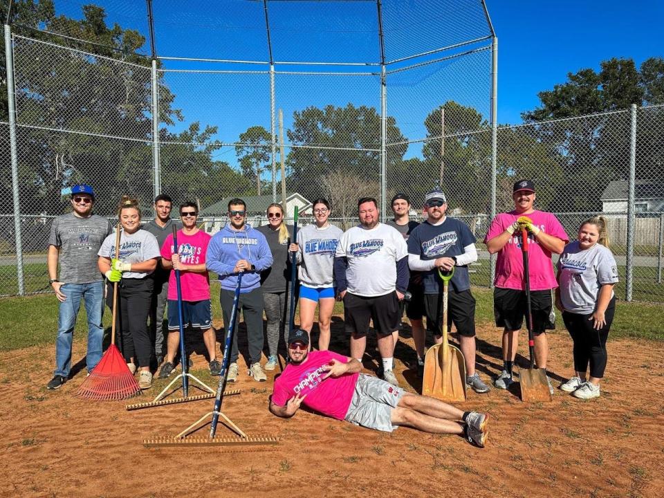 Blue Wahoos staff members teamed earlier in December to help restore a City of Pensacola youth baseball field as part of annual project.