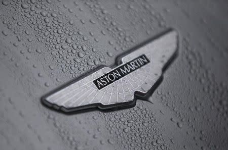 The badge of an Aston Martin DB10 is displayed at a UK Trade and Investment event in London, Britain October 21, 2015. REUTERS/Neil Hall