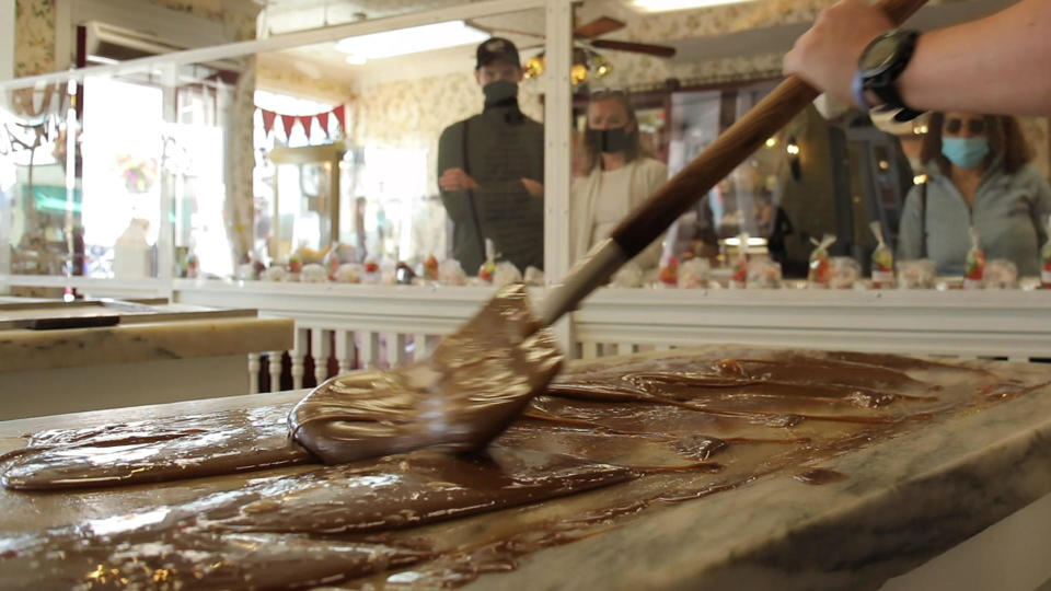 Mix sugar, milk, butter and chocolate, pour it onto a marble slab, and work it until the mixture solidifies. Then, eat!  / Credit: CBS News