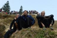 Local residents watch Chinese New Year buffalo fighting competition at the Miao Minority village of Biasha, in Guizhou Province, on February 4, 2014