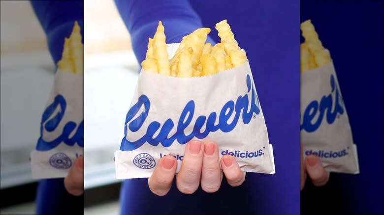 person holding culvers fries