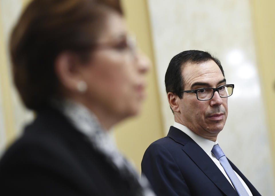 Jovita Carranza, Administrator U.S. Small Business Administration, testifies as Treasury Secretary Steven Mnuchin looks on, during a Senate Small Business and Entrepreneurship hearing to examine implementation of Title I of the CARES Act, Wednesday, June 10, 2020 on Capitol Hill in Washington. (Kevin Dietsch/Pool via AP)