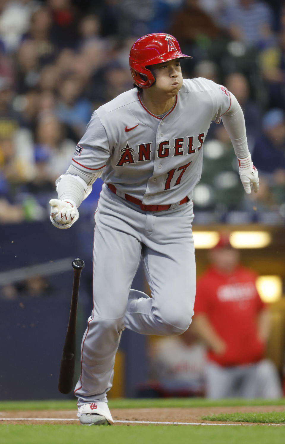 Los Angeles Angels designated hitter Shohei Ohtani heads toward first after hitting into a fielder's choice against the Milwaukee Brewers during the first inning of a baseball game Friday, April 28, 2023, in Milwaukee. (AP Photo/Jeffrey Phelps)